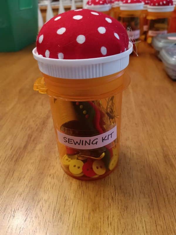 repurpose a pill bottle into a sewing kit