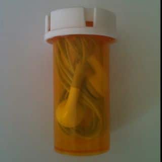 repurpose pill bottles - easy earphone storage