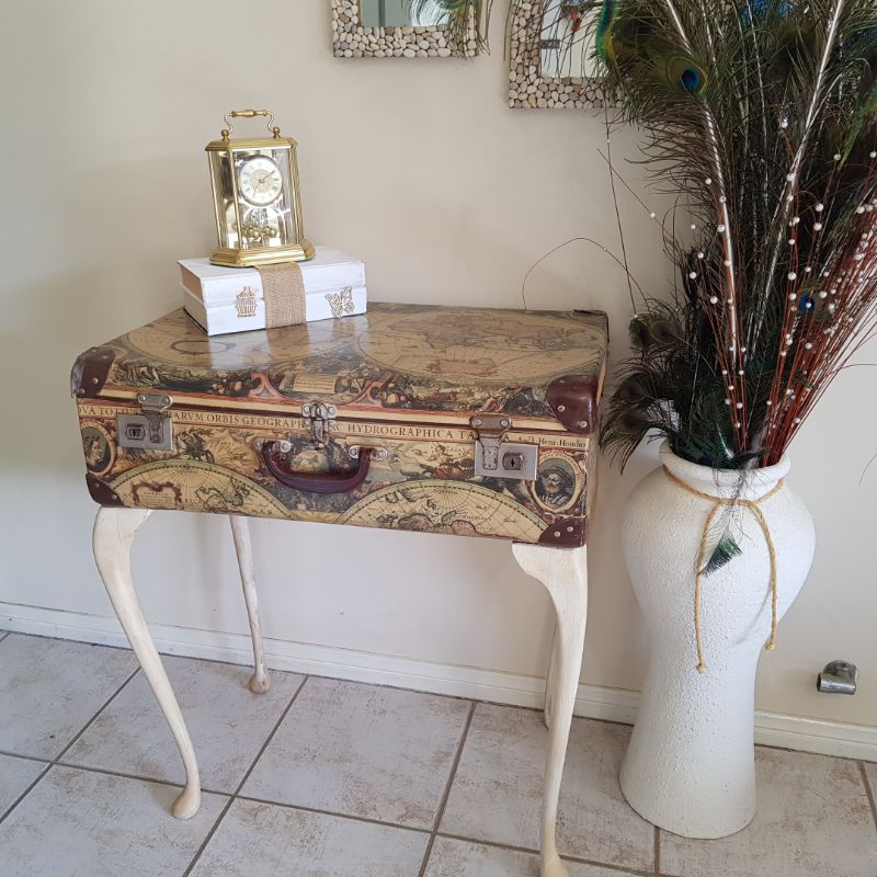 turn junk into home decor -suitcase to decorative table