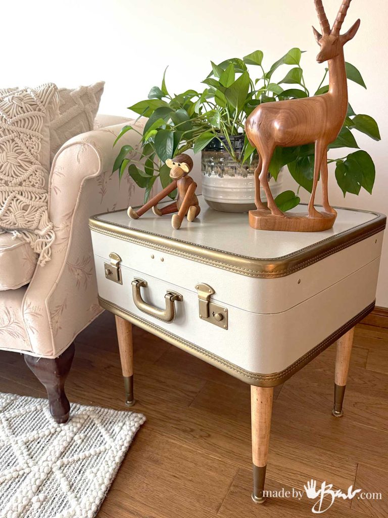 turn junk into home decor -suitcase to decorative table