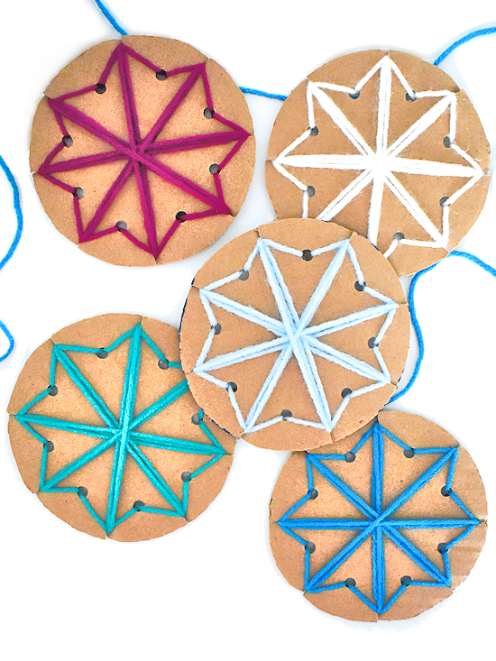 winter crafts for kids - cardboard lacing snowflakes